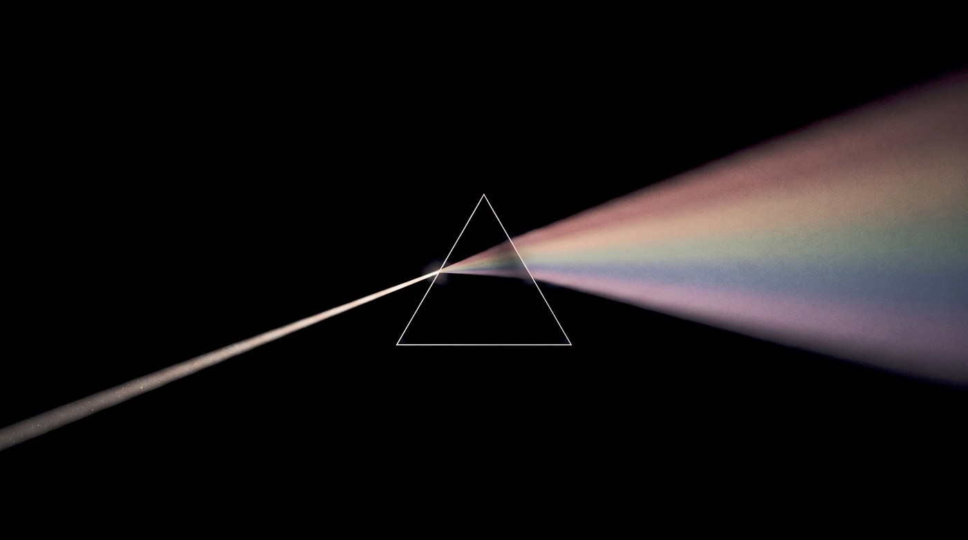A beam of light entering a prism and fanning out as one soft muted stream of color
